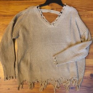 Oversized, tattered sweater